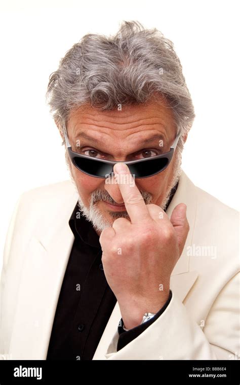 Man Pushing A Pair Of Sunglasses Back Up Nose Stock Photo Alamy