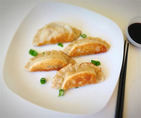 Flip the pan upside down while pressing the plate to invert the. Gyoza dumplings recipe, How to make dumplings | Sandhya's ...