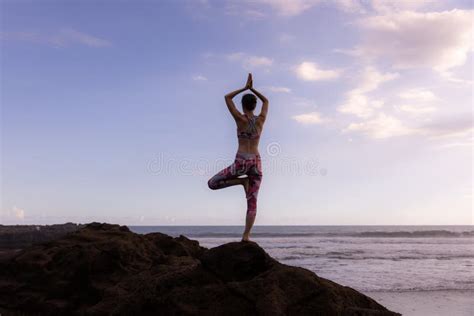 Outdoor Yoga Vrikshasana Asana Woman Practicing Tree Pose On The Rock