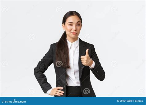 pleased female entrepreneur lady boss in black suit satisfied with your work showing thumbs up