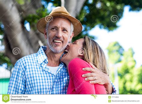 Romantic Mature Couple Laughing Against Tree Stock Image Image Of Bonding Joyful 77714903