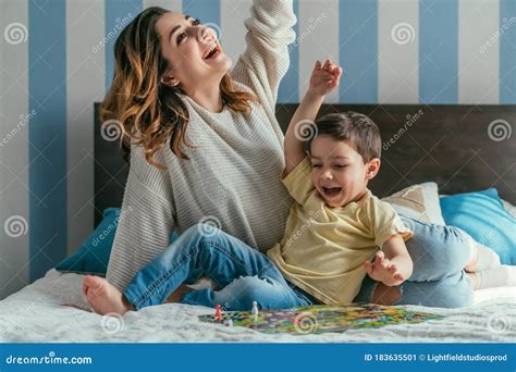 Excited Mother And Son Showing Winner Stock Image Image Of Smiling