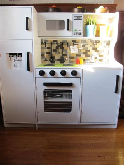 Step by step instructions for how to create a custom play kitchen for your little ones. play kitchen makeover - the after | Kitchen diy makeover ...