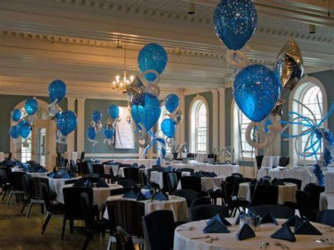 Blue And White Balloons Are Hanging From The Ceiling In A Banquet Hall