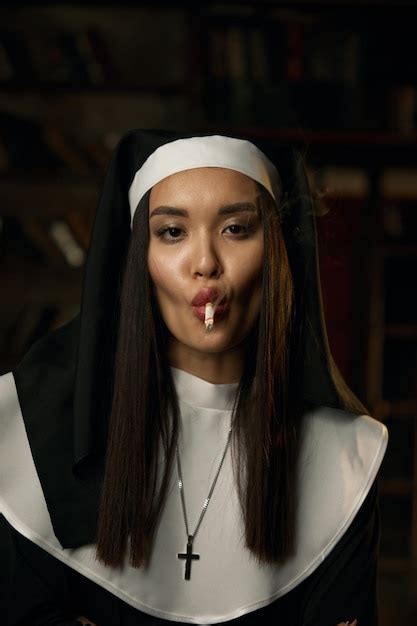 Premium Photo Portrait Of Naughty Sexy Nun Wearing Robe And Headdress