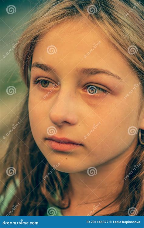Beautiful Sad Little Girl Crying On Summer Background Portrait Of A