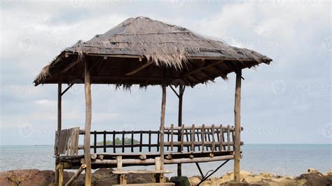 Tropical Asian Beach Hut Natural Wooden Handmade And Thatch Roof On The