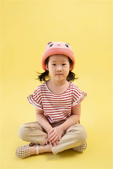 premium photo asian girl posing with cute hat