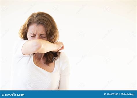 Woman Coughing Or Sneezing In Her Elbow Stock Photo Image Of Disease