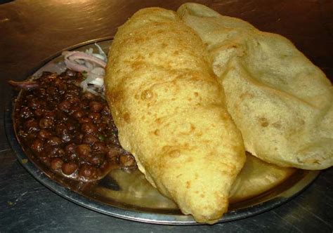 Chole bhature is a combination of chana masala (spicy white chickpeas) and bhatura, a fried bread punjabi chole bhature is not just food; Top 10 best street food in Delhi | Lifestyle News - India TV