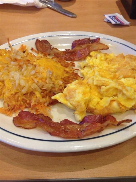 Onion And Cheese Hash Browns Cheesy Scrambled Eggs And Bacon Yelp