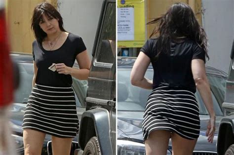 daisy lowe shows off her incredible pins and almost flashes her pants in a tight micro mini