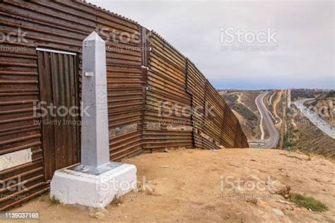 A Monolith Mark The Line Along The Usmexico Border In Tijuana Beach In