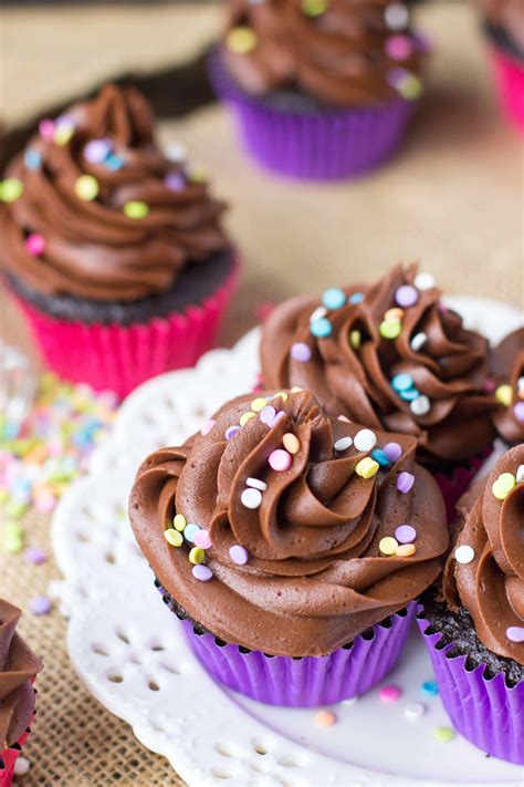Chocolate cupcakes with strawberry frosting. Easy Chocolate Cupcakes - Sugar Spun Run
