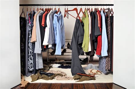 Womans Messy And Unorganized Clothes Closet Stock Photo Download