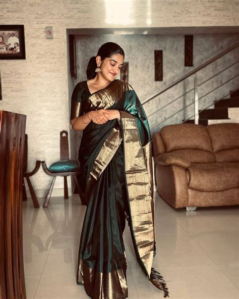 beautiful nivetha thomas in green silk saree outfit k4 fashion