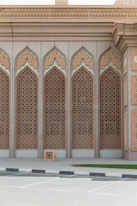 Arabic Pattern Wall Of The Building With Tree At Dubai Royalty Free
