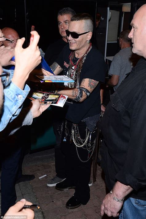 Johnny Depp Puffs On A Cigarette As He Steps Out In Poland Daily Mail Online