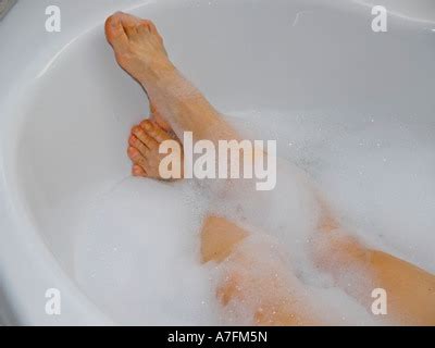 Legs Looking Out From Bubble Bath Foam Bath Stock Photo Alamy