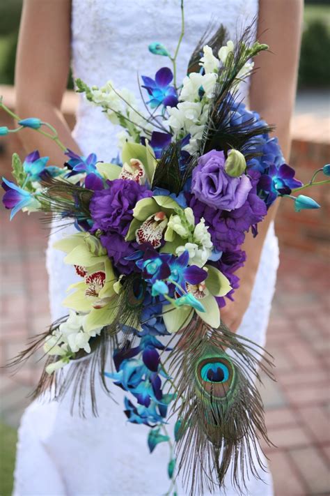 I have included purple sophia roses, purple georgia roses, teal dahlias with pearl and rhinestone centers, white true touch roses, and of course the lovely peacock feathers. Picture Of Awesome Peacock Wedding Ideas