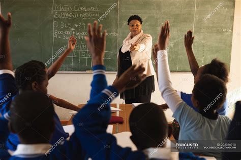 Front View Of A Middle Aged African Female School Teacher Standing At