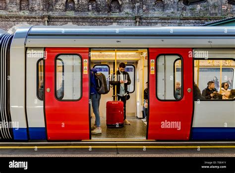 People On A District Linecircle Line Train Waiting For The Doors To