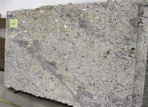 White ice granite features a pale steel grey and bright white background flecked with black. The Beauty of White Ice Granite