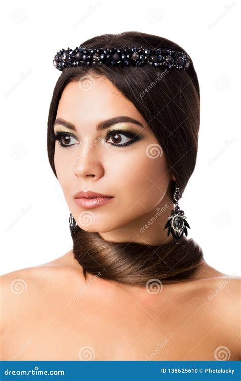 Portrait Of Beautiful Brunette Woman With Big Earring And Shinny Accessories With Hair Around