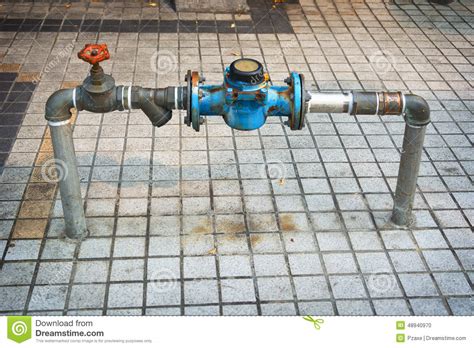 Main Water Line With Meter And Valve On Public Sidewalk