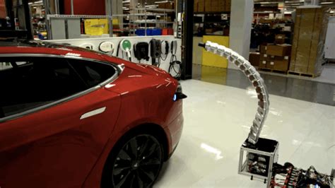 Teslas Charging Prototype Is A Gigeresque Prehensile Robotic Penis