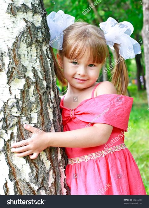 Adorable Little Girl Outdoors Poses At Tree Stock Photo 63246133