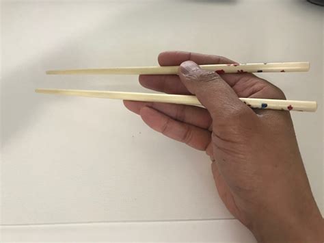 Extend right arm up over head and calmly chinese people do this only when they burn incense to sacrifice the dead. Learn Chopsticks Quickly - Hard Choices, Easy Life