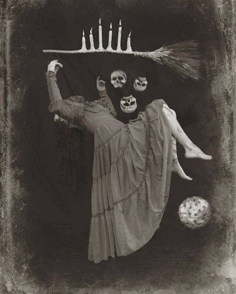 An Old Black And White Photo Of A Woman With Candles On Her Head