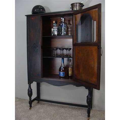 Check spelling or type a new query. Antique Ebonized Wood Lock Liquor Cabinet | Chairish
