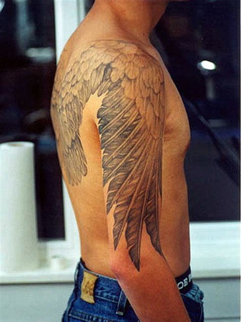 Angel wings back tattoo men 2. 35 Graceful Wings Shoulder Tattoos