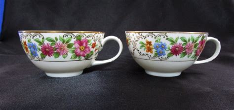 antique crown hc imperial teacup pair   floral china