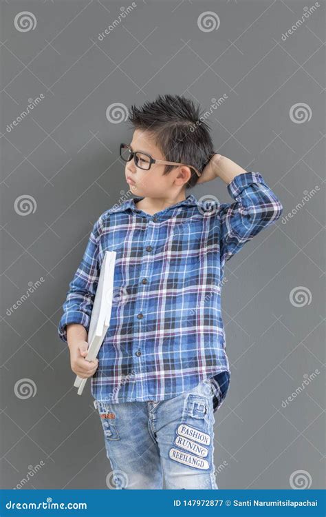 Little Student Boy Feels Nervous And Thinking Something His Hands Hold