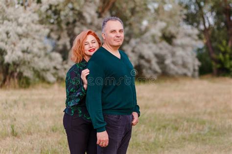 A Woman Hugs A Man In The Summer Middle Aged Husband And Wife Stock