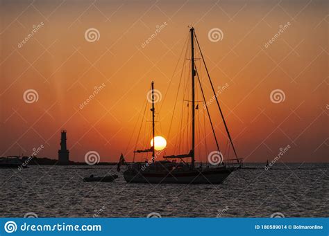 Red Sky In A Sunset Over The Sea The Silhouettes Of A