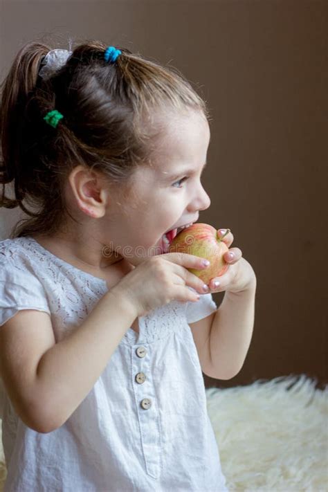 Funny Little Girl Kid Eats An Apple Stock Image Image Of Toddler