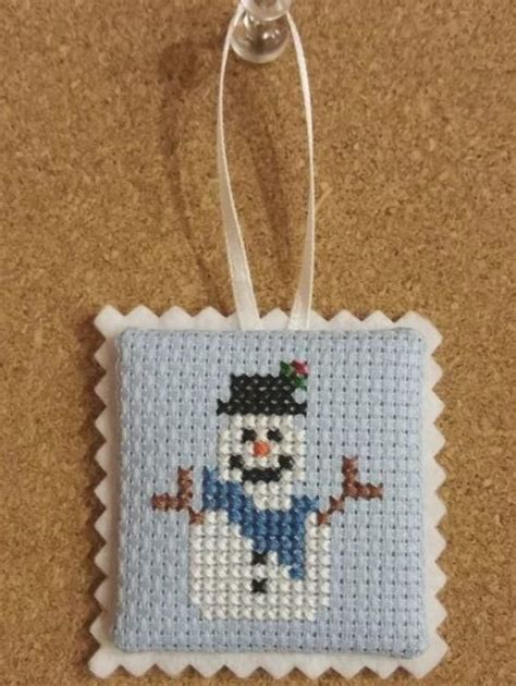 Baby cross stitch patterns cross stitch baby counted cross stitch patterns dimensions cross stitch baby hug needlework shops birth records personalized baby gifts joanns fabric and crafts. Articoli simili a Snowman cross stitch ornament, completed ...
