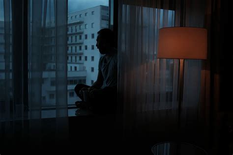 Hd Wallpaper Man Sitting Beside Glass Window Near High Rise Building