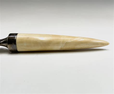 Lot 63 An Ivory And Silver Mounted Paper Knife