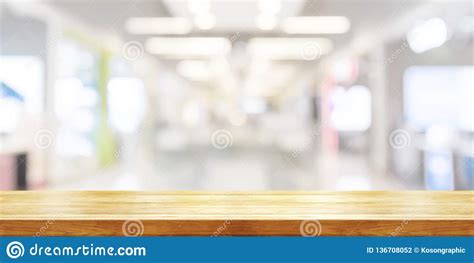 Empty Wooden Table Top With Blurred Modern Shopping Mall