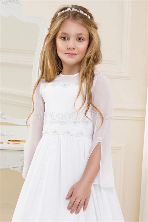 Stunning Beauty Young Girl Model In The White Communion Dress Stock