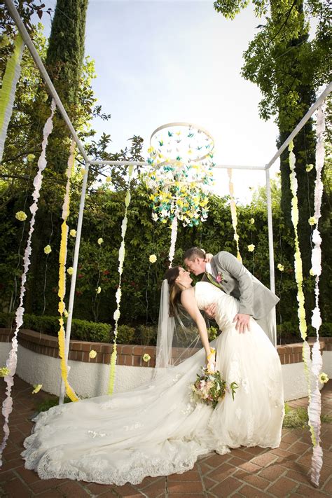 Whimsical Garden Wedding Outdoor Venue Bride Groom Kiss
