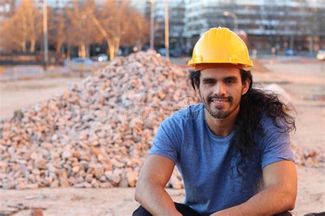 Muscular Tough Long Haired Ethnic Construction Worker Stock Image