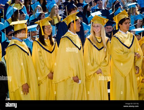 Wearing Caps And Gowns High School Seniors Participate In Graduation