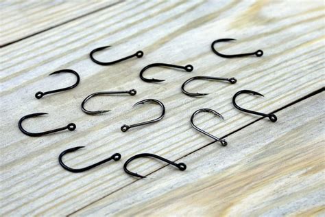 Twelve Hooks On Wooden Surface Metal Fishing Hooks Stock Image Image