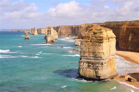 The Twelve Apostles A Famous Rock Formation Surrounded By Turquoise